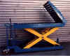 Converyor on a scissor lift.